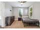 Bedroom includes carpet flooring, a ceiling fan, and plentiful natural light at 1685 Tabor Dr, Marietta, GA 30062