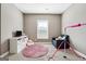 Cozy bedroom with a blue chair, entertainment center, and carpet at 1685 Tabor Dr, Marietta, GA 30062