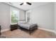 Bright bedroom with carpeted floors, a ceiling fan, and large windows at 1685 Tabor Dr, Marietta, GA 30062