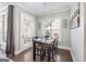 Inviting dining area featuring hardwood floors, natural light, and a view to the outdoors at 1685 Tabor Dr, Marietta, GA 30062