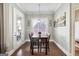 Cozy dining room bathed in soft light, featuring warm hardwood floors and white trim at 1685 Tabor Dr, Marietta, GA 30062