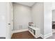 Functional entryway features a built-in bench with storage and decor pillows at 1685 Tabor Dr, Marietta, GA 30062