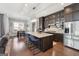 Well-equipped kitchen with a spacious island, dark cabinets, stainless appliances, and breakfast area at 1685 Tabor Dr, Marietta, GA 30062