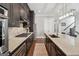 Bright kitchen features stainless steel appliances, granite countertops, and custom cabinetry at 1685 Tabor Dr, Marietta, GA 30062