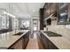 Open kitchen featuring granite countertops, stainless steel appliances and dark wood cabinetry at 1685 Tabor Dr, Marietta, GA 30062