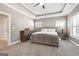 Large main bedroom with a tray ceiling, neutral gray walls, and natural light at 1685 Tabor Dr, Marietta, GA 30062