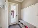 Welcoming mud room with storage bench, hooks, and stylish design, blending functionality with aesthetics at 1685 Tabor Dr, Marietta, GA 30062