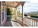 Covered porch with white railings and a scenic view of the neighborhood at 1685 Tabor Dr, Marietta, GA 30062