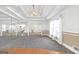 Bright living room featuring an staircase with decorative trim and large windows providing natural light at 2329 Crestknoll Cir, Decatur, GA 30032