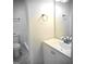 Bright bathroom with white vanity and combination shower and tub at 8053 Woodlake Dr, Riverdale, GA 30274
