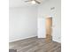 Spacious bedroom with sleek gray floors and a modern ceiling fan at 8053 Woodlake Dr, Riverdale, GA 30274