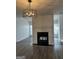 Charming living room featuring fireplace, bright light, and wood-look flooring at 8053 Woodlake Dr, Riverdale, GA 30274