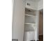 Living room showcasing built-in shelving and wood-look flooring at 8053 Woodlake Dr, Riverdale, GA 30274