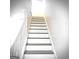 Staircase featuring white risers, painted handrails and dark grey stair treads at 8053 Woodlake Dr, Riverdale, GA 30274