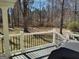 A fenced backyard view from this back porch with an overhead covering at 230 Mapledale Trl, Sharpsburg, GA 30277