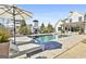 A stylish backyard includes a pool, lounge chairs, and an outdoor fireplace, perfect for entertaining or relaxing at 132 Platinum Rdg, Sharpsburg, GA 30277