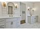 Luxurious bathroom with double vanities, gold fixtures, shiplap walls, and marble tile flooring at 132 Platinum Rdg, Sharpsburg, GA 30277