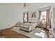 Cozy bedroom with a queen bed, bench, neutral decor, and natural light at 132 Platinum Rdg, Sharpsburg, GA 30277