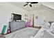 Comfortable bonus room features a ceiling fan, TV console, and cozy seating area at 132 Platinum Rdg, Sharpsburg, GA 30277