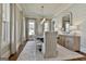 Charming dining room featuring elegant wallpaper, hardwood floors, natural light, and a modern chandelier at 132 Platinum Rdg, Sharpsburg, GA 30277