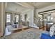 Elegant dining room with stylish wallpaper, a dining set, and a staircase leading to another level at 132 Platinum Rdg, Sharpsburg, GA 30277