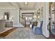 Welcoming foyer with hardwood floors, elegant wallpaper, and a view into the spacious living areas at 132 Platinum Rdg, Sharpsburg, GA 30277
