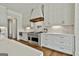 Modern kitchen featuring stainless steel appliances, white subway tile backsplash, and custom white cabinets at 132 Platinum Rdg, Sharpsburg, GA 30277