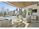 Stylish patio featuring a modern outdoor seating area, grill, and view of the backyard and pool at 132 Platinum Rdg, Sharpsburg, GA 30277