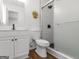 Modern bathroom showcasing a glass shower, white vanity, and marbled tile at 321 Pleasant Valley Rd, Mcdonough, GA 30253