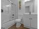 The bathroom features a shower over tub, and a vanity with modern fixtures at 321 Pleasant Valley Rd, Mcdonough, GA 30253