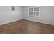 A bright bedroom space featuring wood-look flooring and a window at 321 Pleasant Valley Rd, Mcdonough, GA 30253