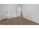 Clean bedroom with wood-look floors, white walls, and closet at 321 Pleasant Valley Rd, Mcdonough, GA 30253