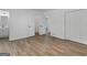 Light-filled bedroom featuring wood-look floors and ample closet space at 321 Pleasant Valley Rd, Mcdonough, GA 30253