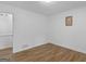 Cozy bedroom featuring wood-look floors, neutral walls, and natural light at 321 Pleasant Valley Rd, Mcdonough, GA 30253