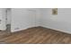 Bright bedroom with wood-look floors, closet, and neutral walls at 321 Pleasant Valley Rd, Mcdonough, GA 30253
