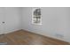 A bright bedroom with wood-look floors and a large window at 321 Pleasant Valley Rd, Mcdonough, GA 30253