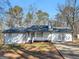 Charming single-story home with a covered porch and well-maintained front yard at 321 Pleasant Valley Rd, Mcdonough, GA 30253