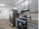 Updated kitchen featuring stainless steel appliances and modern finishes at 321 Pleasant Valley Rd, Mcdonough, GA 30253