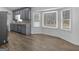 Modern kitchen featuring stainless steel appliances, sleek gray cabinets, and a bright bay window at 321 Pleasant Valley Rd, Mcdonough, GA 30253