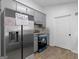 Well-appointed kitchen with stainless steel refrigerator and plenty of counter space at 321 Pleasant Valley Rd, Mcdonough, GA 30253