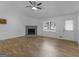 Inviting living room with a fireplace, bright window, and easy access to the front door at 321 Pleasant Valley Rd, Mcdonough, GA 30253