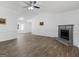 Open-concept living space with wood floors, neutral paint, and a cozy fireplace at 321 Pleasant Valley Rd, Mcdonough, GA 30253