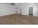 A spacious living room features wood-look flooring and ample natural light at 321 Pleasant Valley Rd, Mcdonough, GA 30253