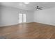 Bright living room featuring a ceiling fan, and French doors that let in natural light at 321 Pleasant Valley Rd, Mcdonough, GA 30253