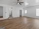 This living room offers ample space with wood-look flooring and neutral decor at 321 Pleasant Valley Rd, Mcdonough, GA 30253