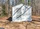 Outbuilding in backyard surrounded by mature trees at 321 Pleasant Valley Rd, Mcdonough, GA 30253