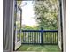 Balcony view featuring greenery, a wood fence, and a bright blue sky at 870 Monroe Ne Dr, Atlanta, GA 30308