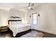 This bedroom features a ceiling fan, side table lamps and an area rug at 870 Monroe Ne Dr, Atlanta, GA 30308