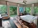 Bright main bedroom with large windows, a private balcony, and a comfortable king-size bed at 870 Monroe Ne Dr, Atlanta, GA 30308