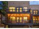 Multi-level house exterior with balconies, illuminated by warm, inviting lighting at 870 Monroe Ne Dr, Atlanta, GA 30308